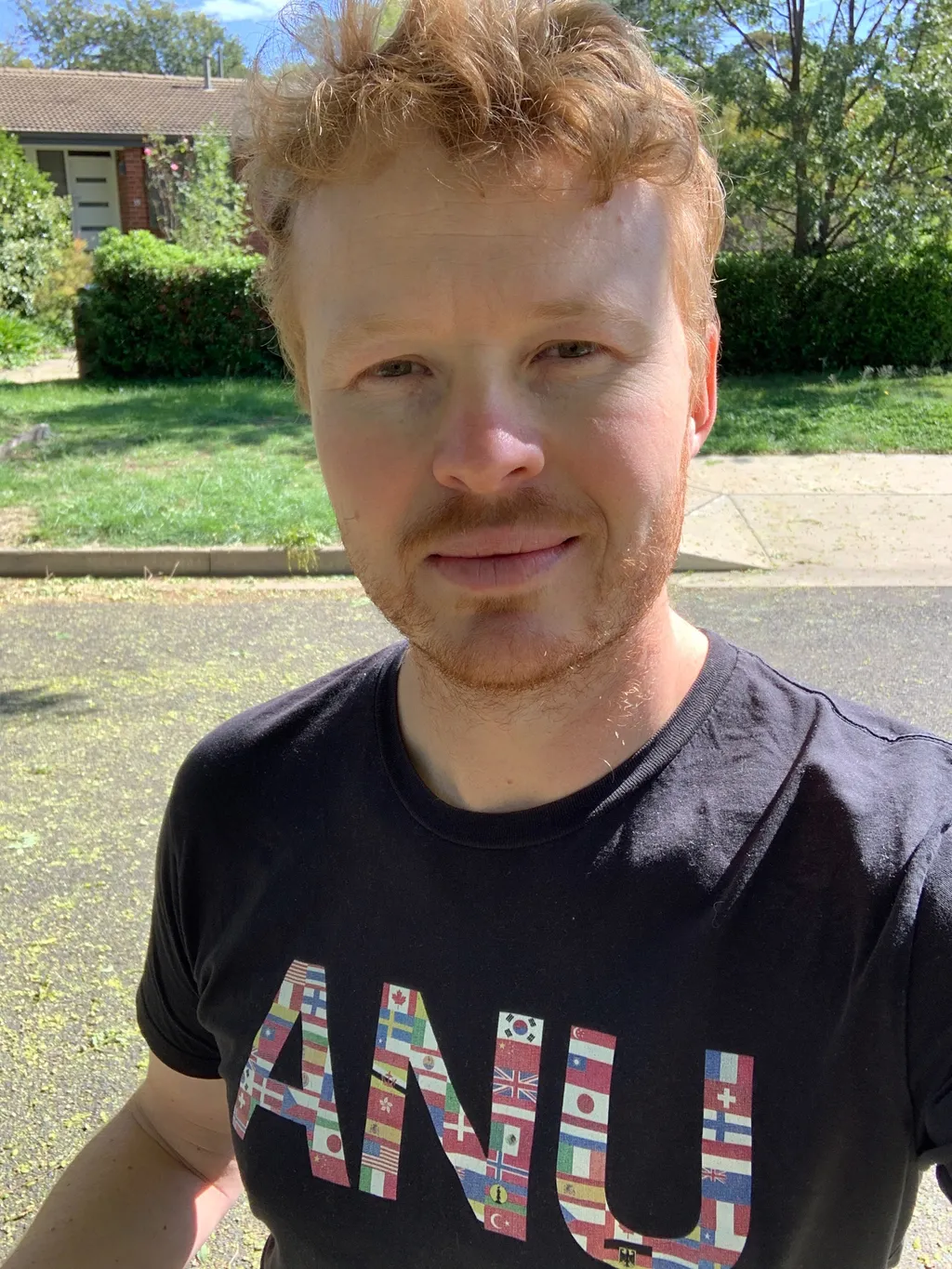 Ben in an ANU T-shirt