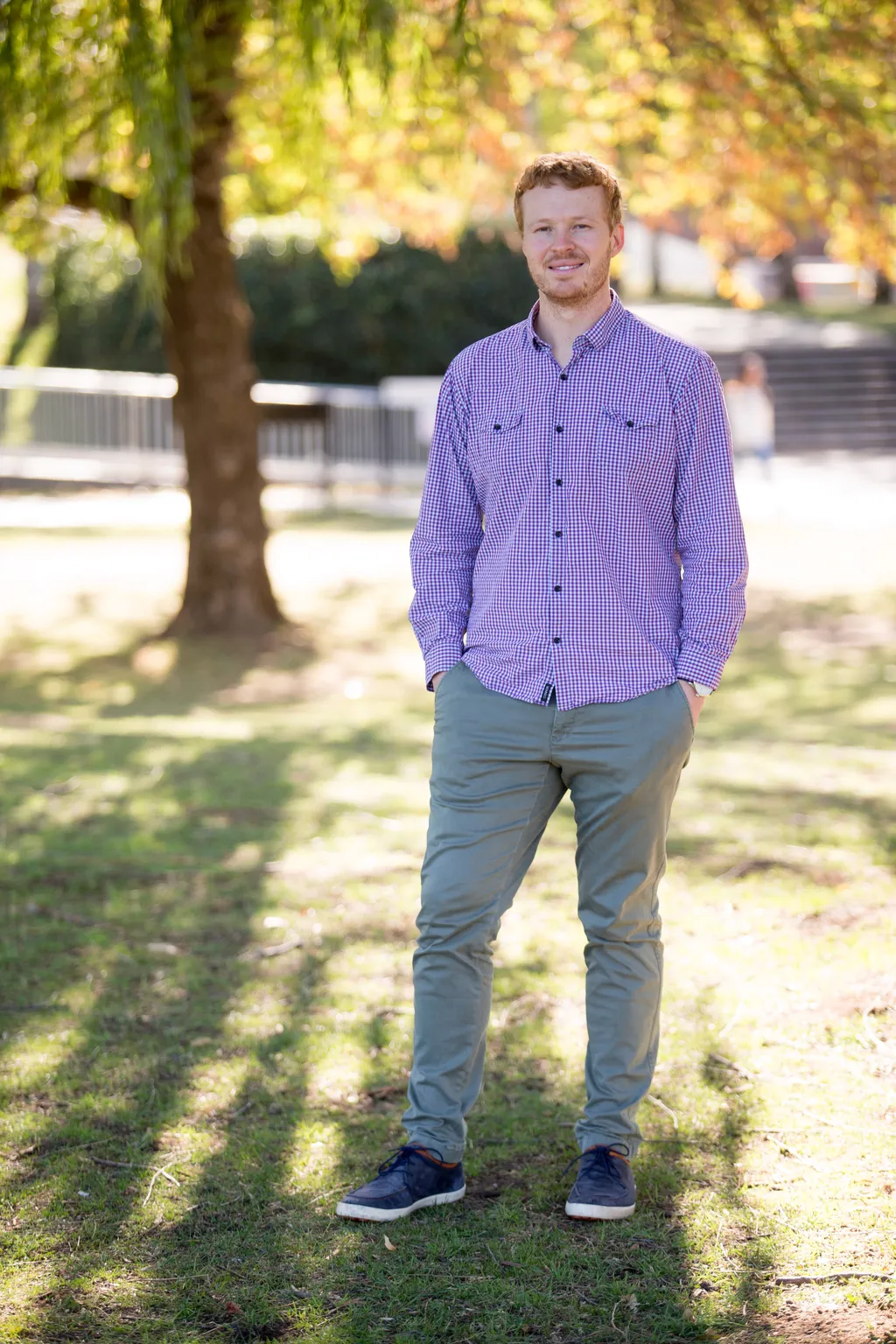 Ben outside on the ANU campus in autumn