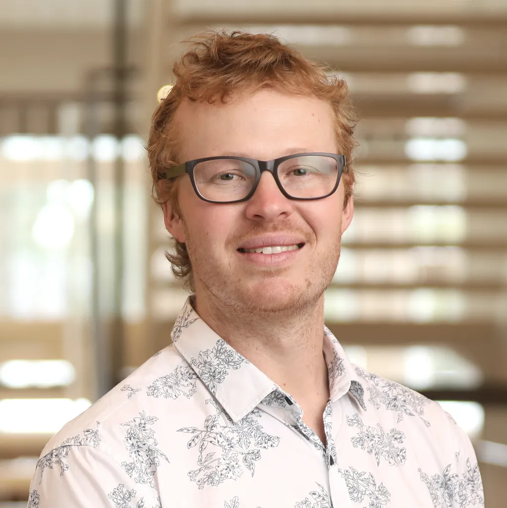 Ben headshot near the stairwell in the ANU Birch building