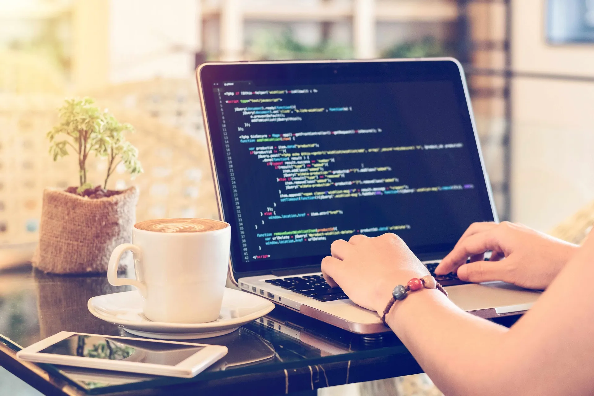 a person typing away at some code on a laptop computer
